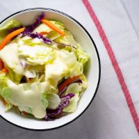 Salad · This classic and simple salad is crisp and refreshing. A cold wedge of iceberg lettuce toppe...