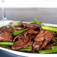 Mongolian Style · Your choice of protein cooked and glazed in a garlic sauce with scallions.