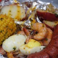 Boiled Shrimp Box Deluxe · 12 jumbo boiled shrimp, smoked link sausage, 1 egg, 2 potato halves and corn on the cob. ser...