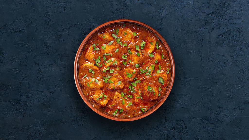 Chicken Tikka Masala · Oven-roasted chicken chunks in a rich creamy tomato and onion base gravy. Served with a portion of rice.
