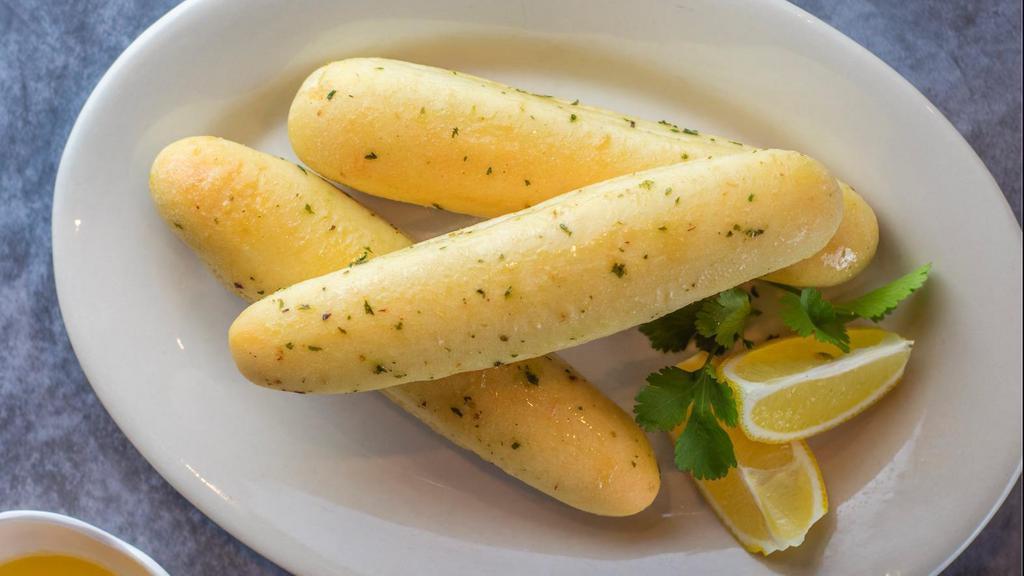 Garlic Breadsticks · Comes with 4 breadsticks and a side of garlic butter.
