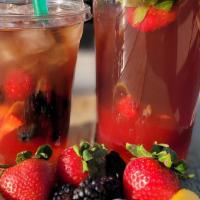Wild Berry Iced Tea · Camellia sinensis, black tea handcrafted with pure cane sugar, fresh lemons, strawberries, b...