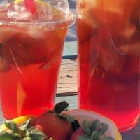 Strawberry Iced Tea  · Camellia sinensis, black tea handcrafted with pure cane sugar, fresh lemons and strawberries.