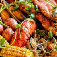 Make Your Own Seafood Boils · Blue Sunday seafood boils served with potato & corn on the cob.