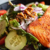 Grilled Salmon Salad · Roman Lettuce , spring mix , cucumbers , tomatoes tossed in balsamic vinaigrette & topped wi...