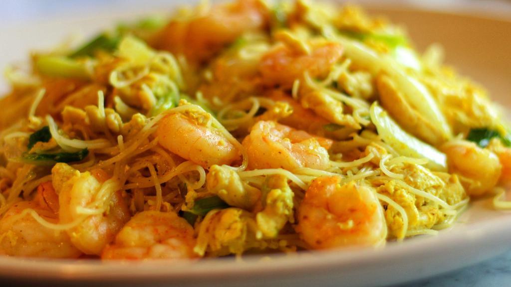Singapore Noodle · Hot and spicy. Spicy Stir fried thin rice noodles with chicken, shrimp, egg, cabbage and scallion with curry flavor sauce.