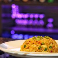 Curry Fried Rice · Hot and spicy. Prepared chicken and shrimp with carrots, green peas, egg & onion.