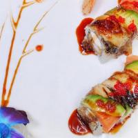 Fantasy Roll · Shrimp tempura, cream cheese, topped with eel, smoked salmon, avocado, masago.