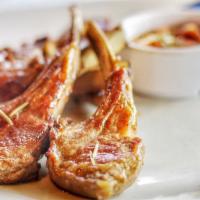 Lamb Rack (5Pc) · Grilled new Zealand baby lamb chop with chef's special sauce on the side.