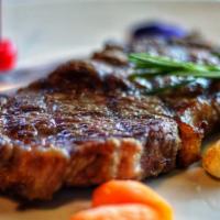 Ribeye Steak (12Oz) · Grilled juicy and flavorful ribeye steak