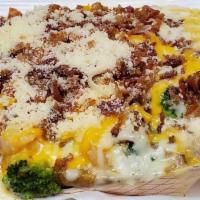 Alfredo Potato · Alfredo Sauce, Butter, Cheese, topped with Dry Parmesan. Add broccoli and bacon to make it S...