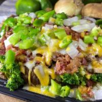 Philly Steak Supreme Potato · Philly-steak, broccoli, mushrooms, bacon, onion, bell pepper and cheese