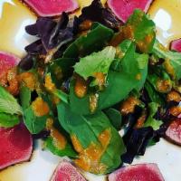 Seared Tuna Tataki · Seared tuna over organic greens with ponzu sauce.