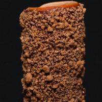 Ferrero Rocher Chimney Cake · Chimney roll, glazed with warm Nutella and sprinkled with crushed and toasted hazelnuts. Tra...
