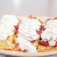 Fruit & Yogurt Crepes With Whipped Cream · Thin pancakes filled with vanilla yogurt and your choice of blueberries or sweetened strawbe...