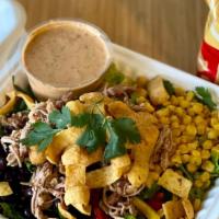 Pulled Pork Taco Salad · Romaine, Cubano Pulled Pork, Black Beans, Roasted Corn, Bell Pepper, Cilantro + Corn Chips w...