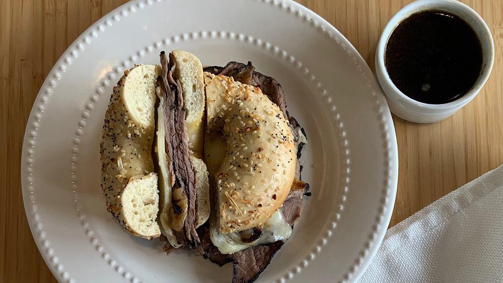 French Dip · Hot roast beef, swiss, caramelized onions with a side of beef au jus for dipping.