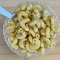 White Cheddar Mac + Cheese · White cheddar twisted elbow macaroni and cheese.