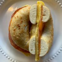 Canadian Eggel  · Your choice of bagel, egg omelet, ham + cheddar.