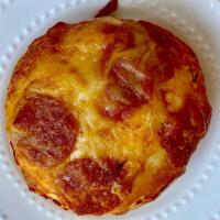 Pepperoni Bialy · Bagel dough topped and baked with pepperoni and mozzarella cheese.
