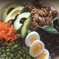 Protein Power Salad · Mixed greens, edamame, dried cranberries, carrots, avocado, walnuts, and boiled eggs.