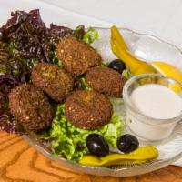 Falafel Appetizer · Combination of chopped fava beans, parsley, onion, garlic and sesame seeds all flavored with...
