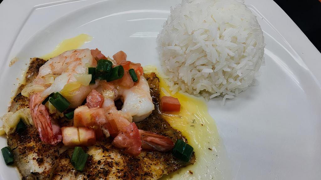 Fish & Shrimp Scampy · 6oz blackened tilapia filet topped with two jumbo shrimp, a garlic butter sauce, tomato, and green onion.  Served with white jasmine rice.