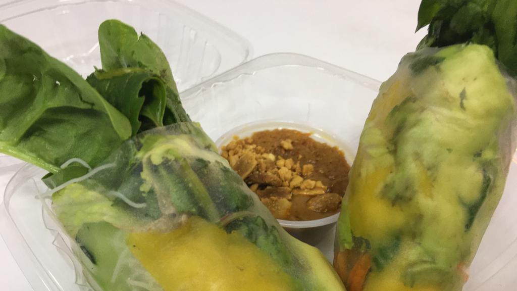 Thai Basil Soft Roll With Mango & Avocado · Two soft wrapped spring rolls filled with rice noodles, basil, carrot, spring mix, cucumber, mango, and avocado. Served with a peanut sauce.