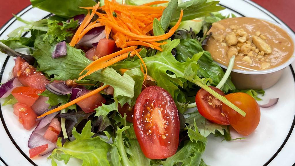 Rose'S Salad (Full Order) · Mixed greens, tomato, red onion, cucumber, carrot, and peanut sauce.