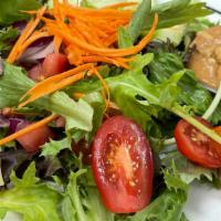 Rose'S Salad (Side) · Mixed greens, tomato, red onion, cucumber, carrot, and peanut sauce.