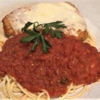 L Chicken Parmigiana · Lightly breaded fried golden brown topped with tomato sauce and mozzarella cheese served ove...
