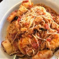 L Seafood Mare Bella · Shrimp, scallops and crab meat sauteed in a light marinara served over angel hair pasta.