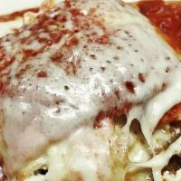 Lasagna · Layers of Pasta with Meat Sauce, Melted Mozzarella, Ricotta Cheese and Parmesan Cheese.