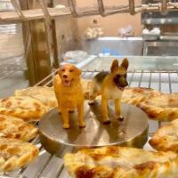 Doggie Em'Paw'Nada · Homemade empanada especially made for dogs