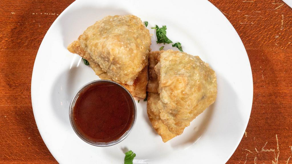 Vegetable Samosa · Traditional pastries stuffed with potatoes, peas and light spices.