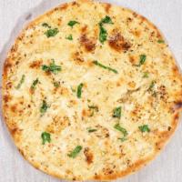 Garlic Naan · Simple but delicious unleavened flat bread, cooked in the clay oven.