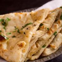 Butter Naan · Simple but delicious unleavened flat bread, cooked in the clay oven.