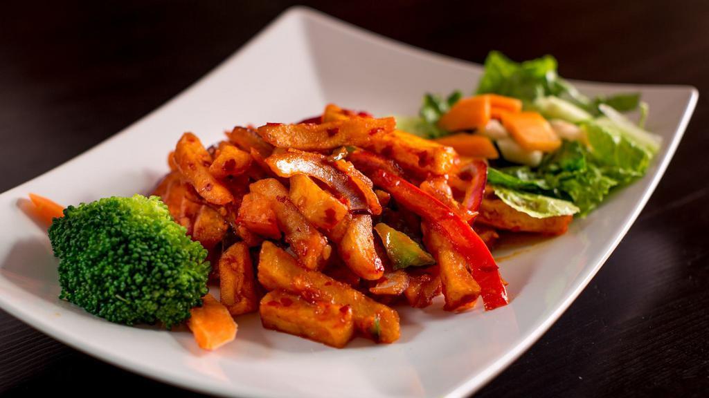 Chilly Chicken · Tender meat cooked with green peppers and red peppers.
