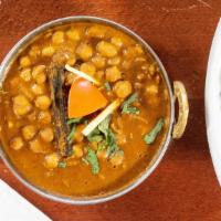 Chana Masala · Whole chickpeas with herbs, onions and tomatoes in punjabi style.