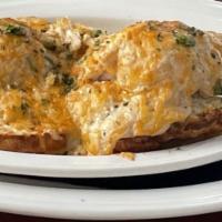Crab Biscuit · Large biscuit and poached eggs smothered with blue crab, cheeses and spices.