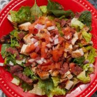 Mardi Gras Salad · Gluten-free. Cajun seasoned chicken with turkey bacon, tomatoes, red onions and low carb sal...