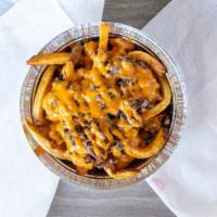 Cheese Steak Fries · Hand cut fries, steak, provolone cheese, grilled onion topped with chipotle aioli.