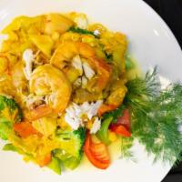 Yellow Curry Seafood · Seafood medley, yellow  curry sauce, bell peppers, mushrooms, and rice on the side