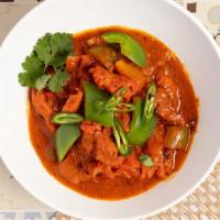 Chicken Tikka Masala · Chicken in butter sauce with green and red bell pepper.