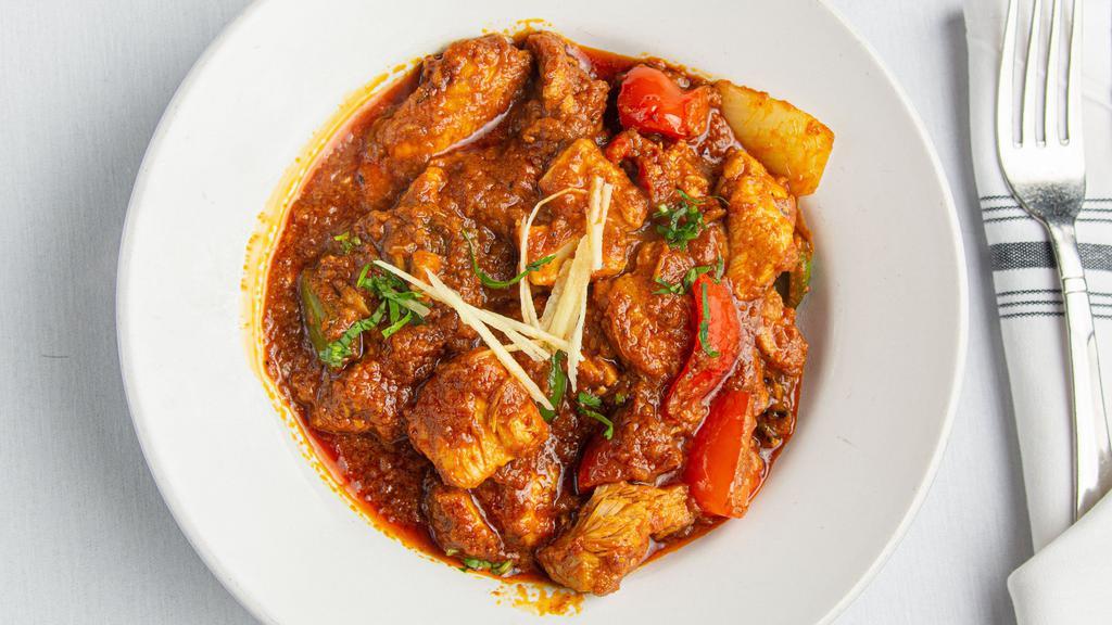 Chicken Kadhai · Chicken in onion sauce with red and green bell pepper.