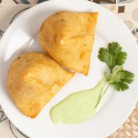 Veg Samosa · Seasoned peas and potatoes wrapped in flaky pastry shell.
3 pieces.