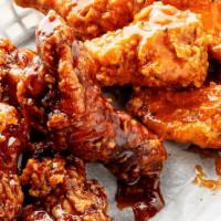 Jumbo Chicken Wings · Jumbo award winning chicken wings. Lightly floured & Double fried then tossed in your favori...