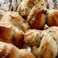 Garlic Knots (4) · Award winning pizza dough tied in a knot and baked to perfection, then tossed in EVOO, Fresh...