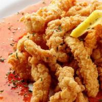 Fried Calamari · Julienned calamari steak fried to perfection and served with sweet Thai pepper sauce.