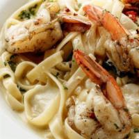 Sinatra With Shrimp · Shrimp sautéed in our Signature white wine lemon butter sauce combined with sun-dried tomato...